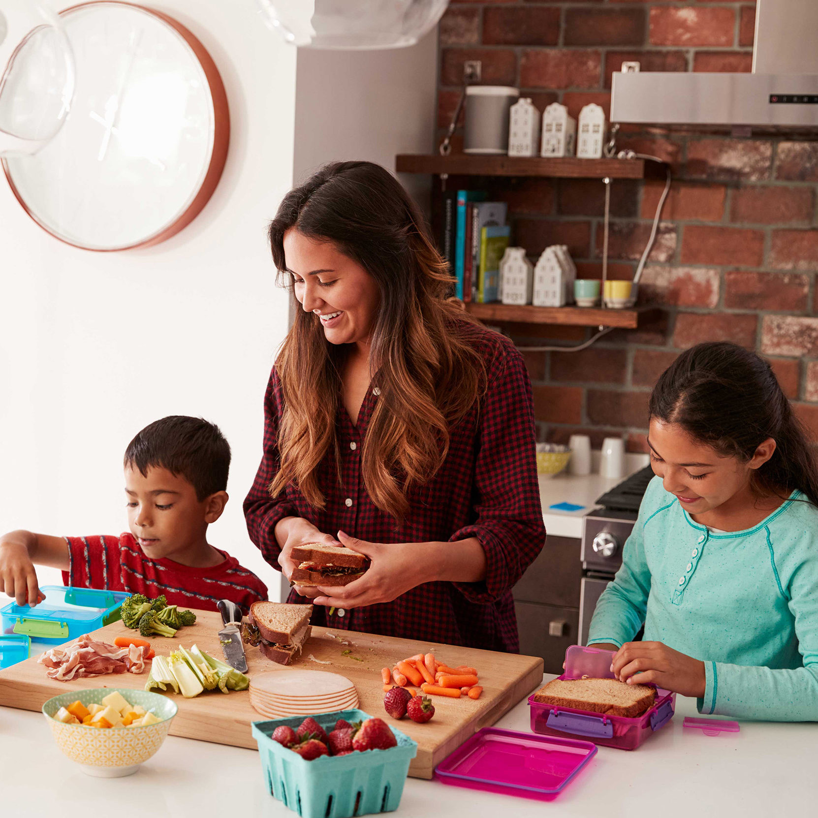 Mom and kids making school lunches 