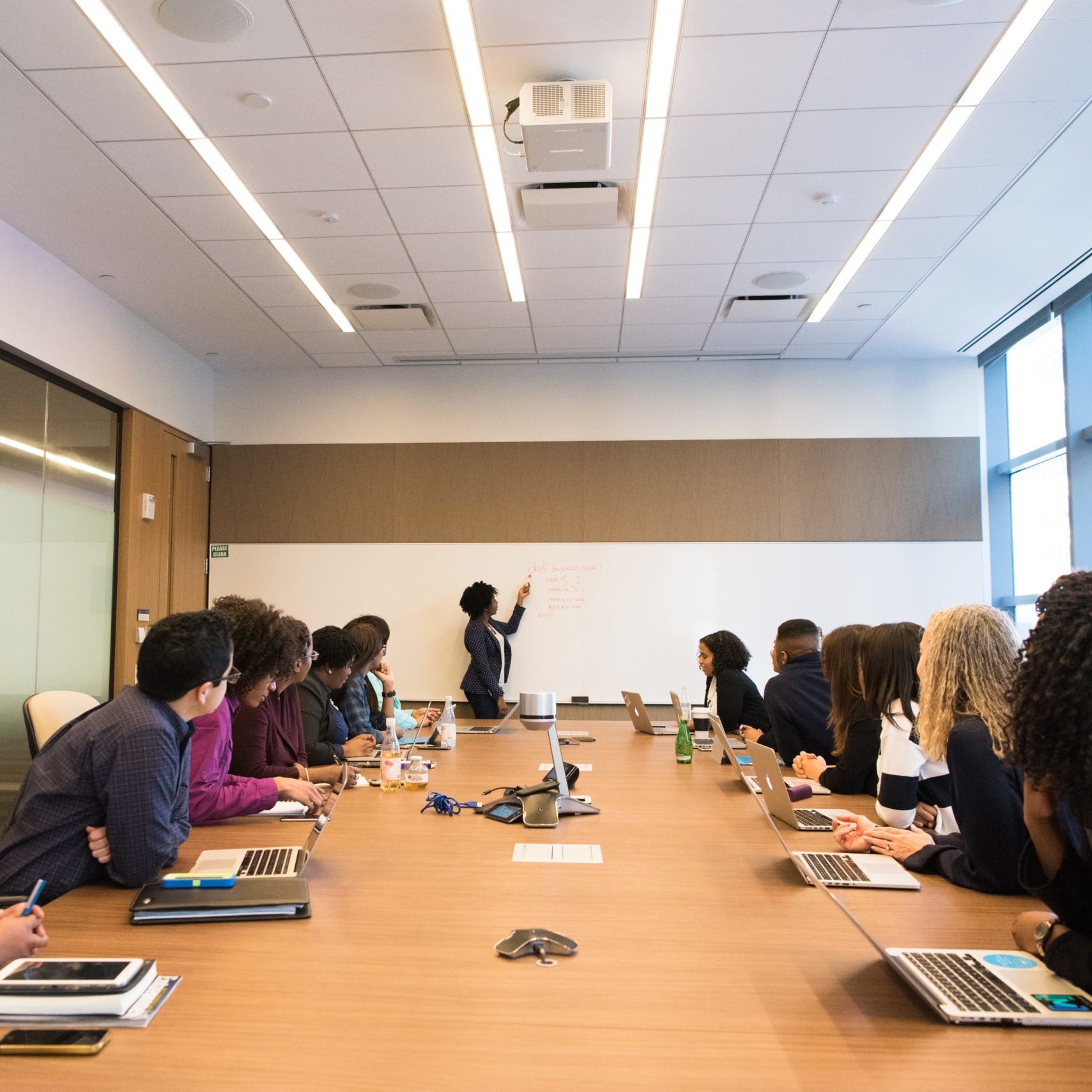 Leadership Development - People in conference room with instructor at front of room 